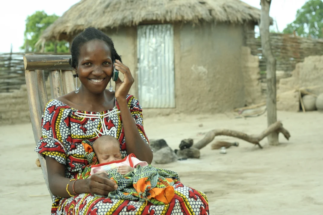 A woman reports the birth of her child by telephone.