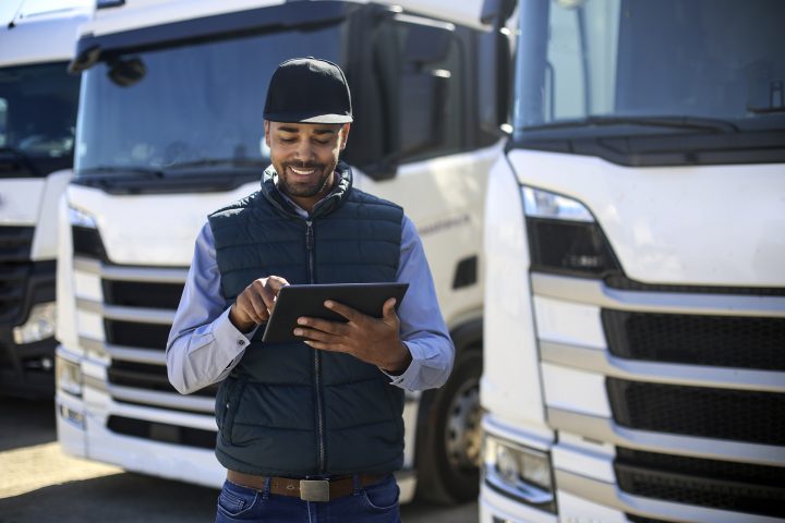 Truck driver using a tablet